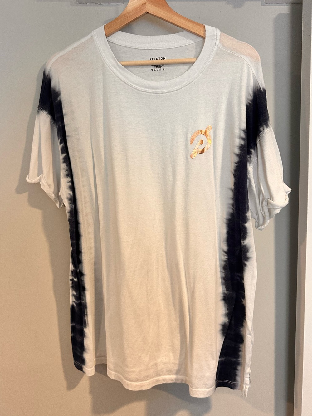 Peloton White Tee with Black Tie-Dye Side Stripes and Gold Logo